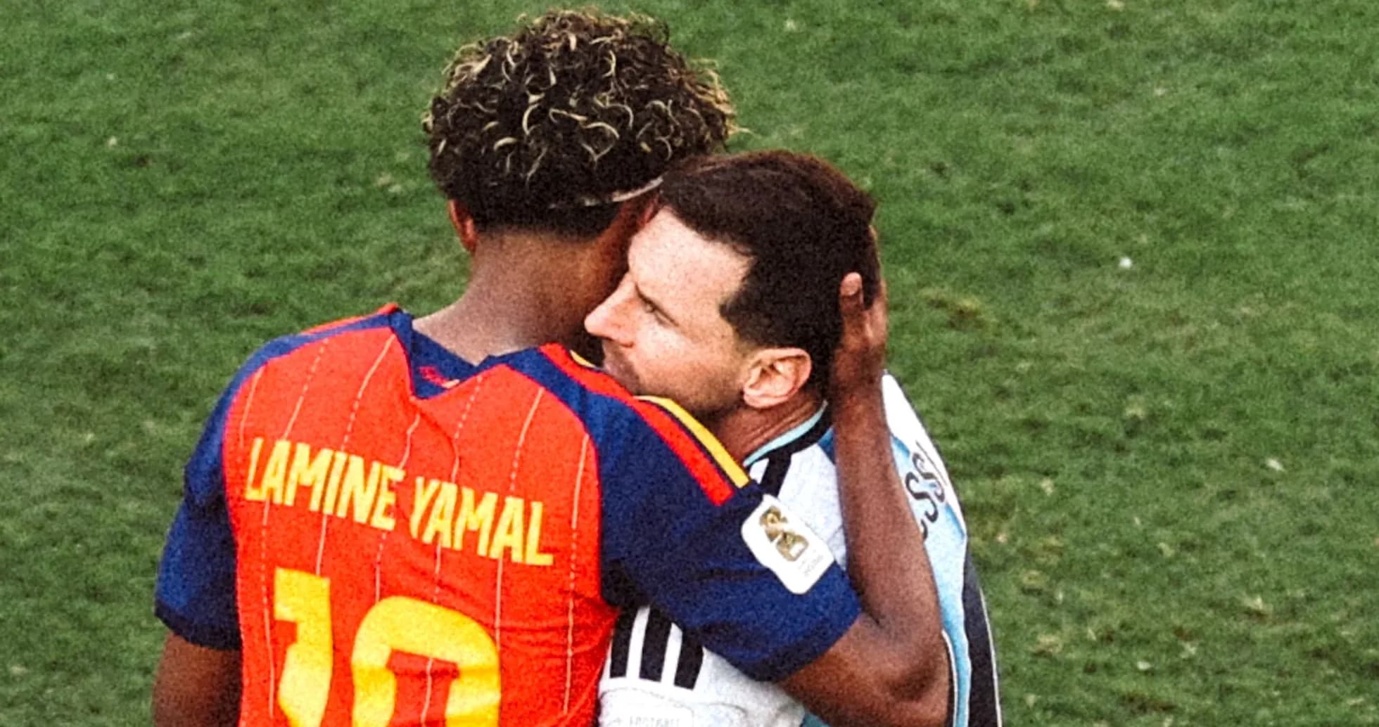 Two players embracing on the field after match Two players embracing on the field after match
