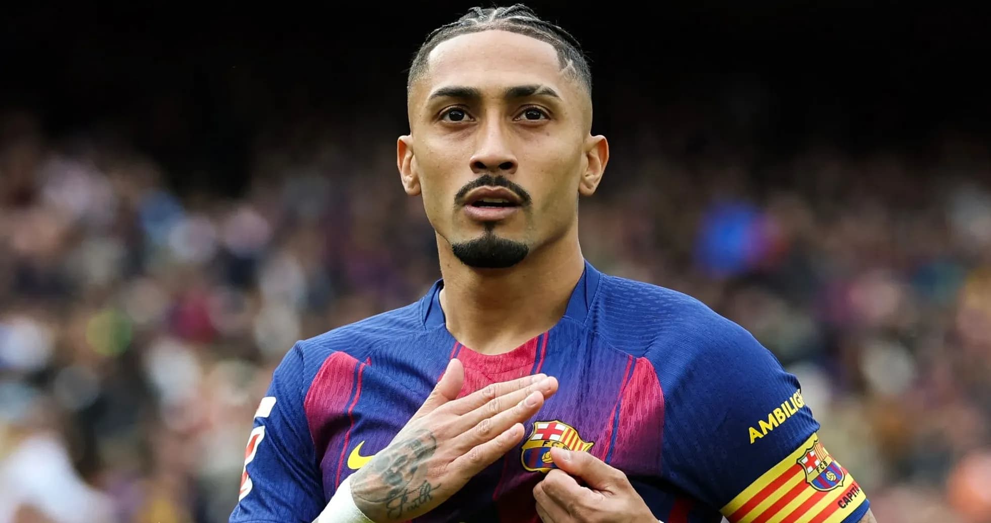 Player touching club badge during match celebration Player touching club badge during match celebration