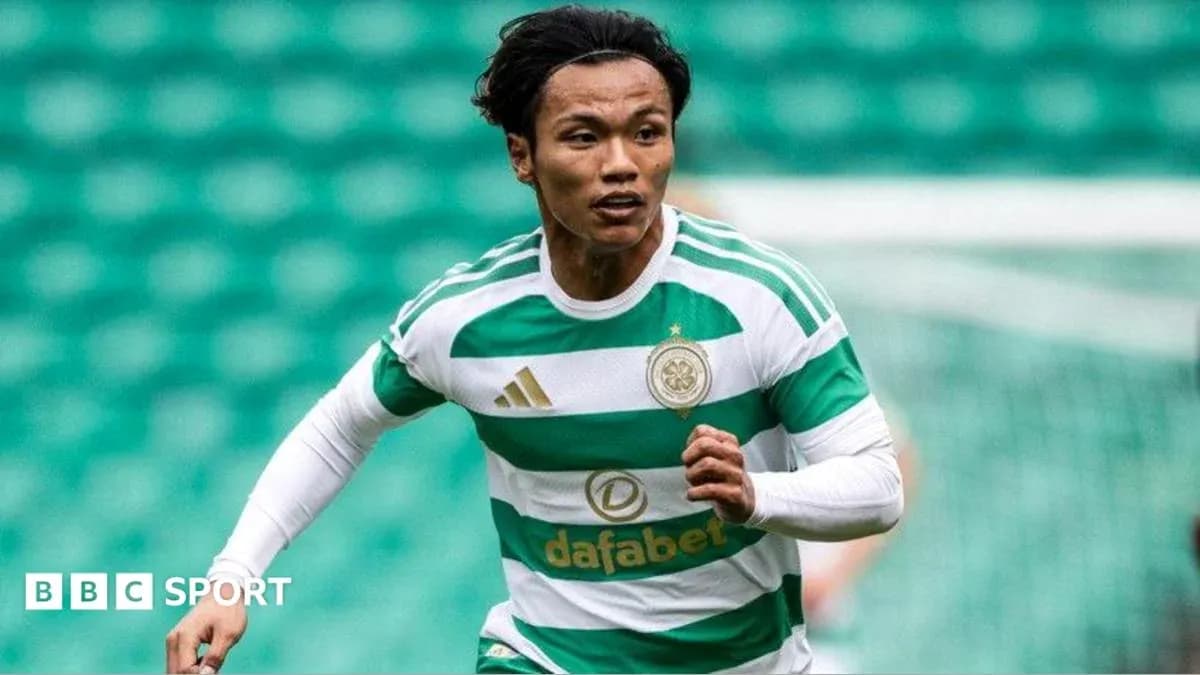 Celtic player running on the pitch during match Celtic player running on the pitch during match