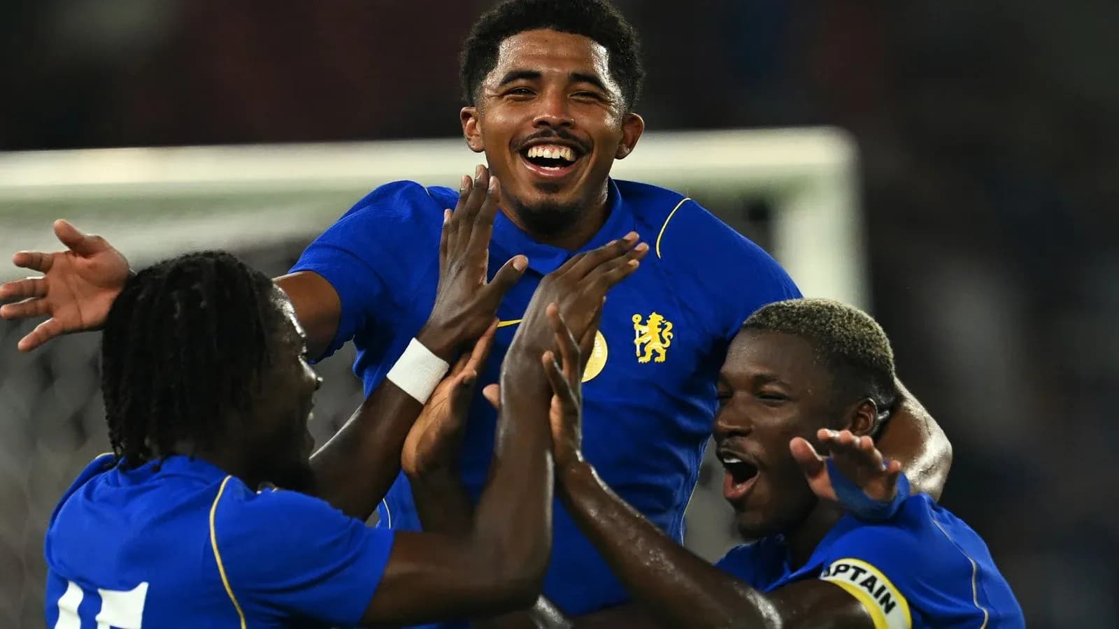 Players celebrating a goal during a match Players celebrating a goal during a match
