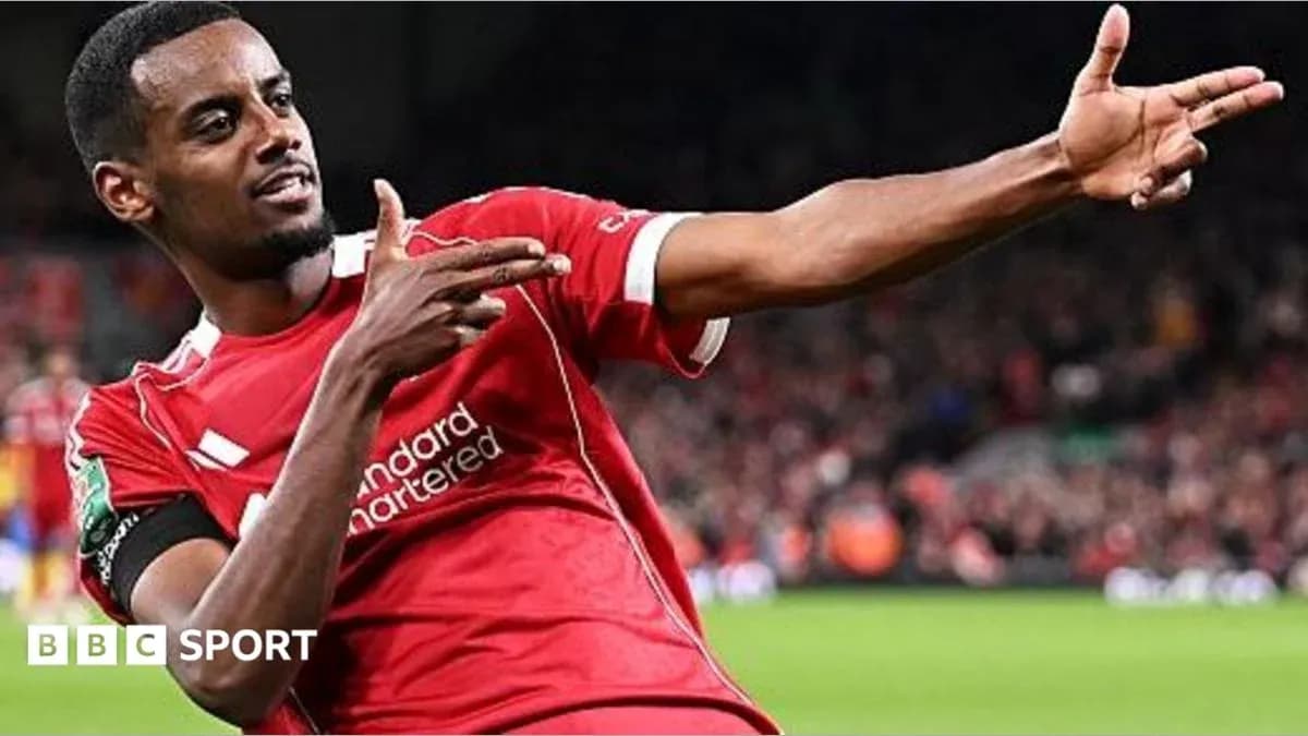 Player celebrating goal with signature pose on field Player celebrating goal with signature pose on field