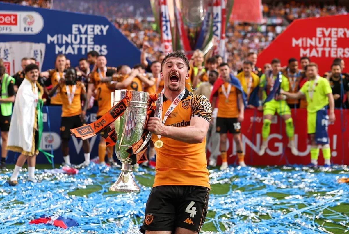 Player celebrating with trophy on victory podium Player celebrating with trophy on victory podium