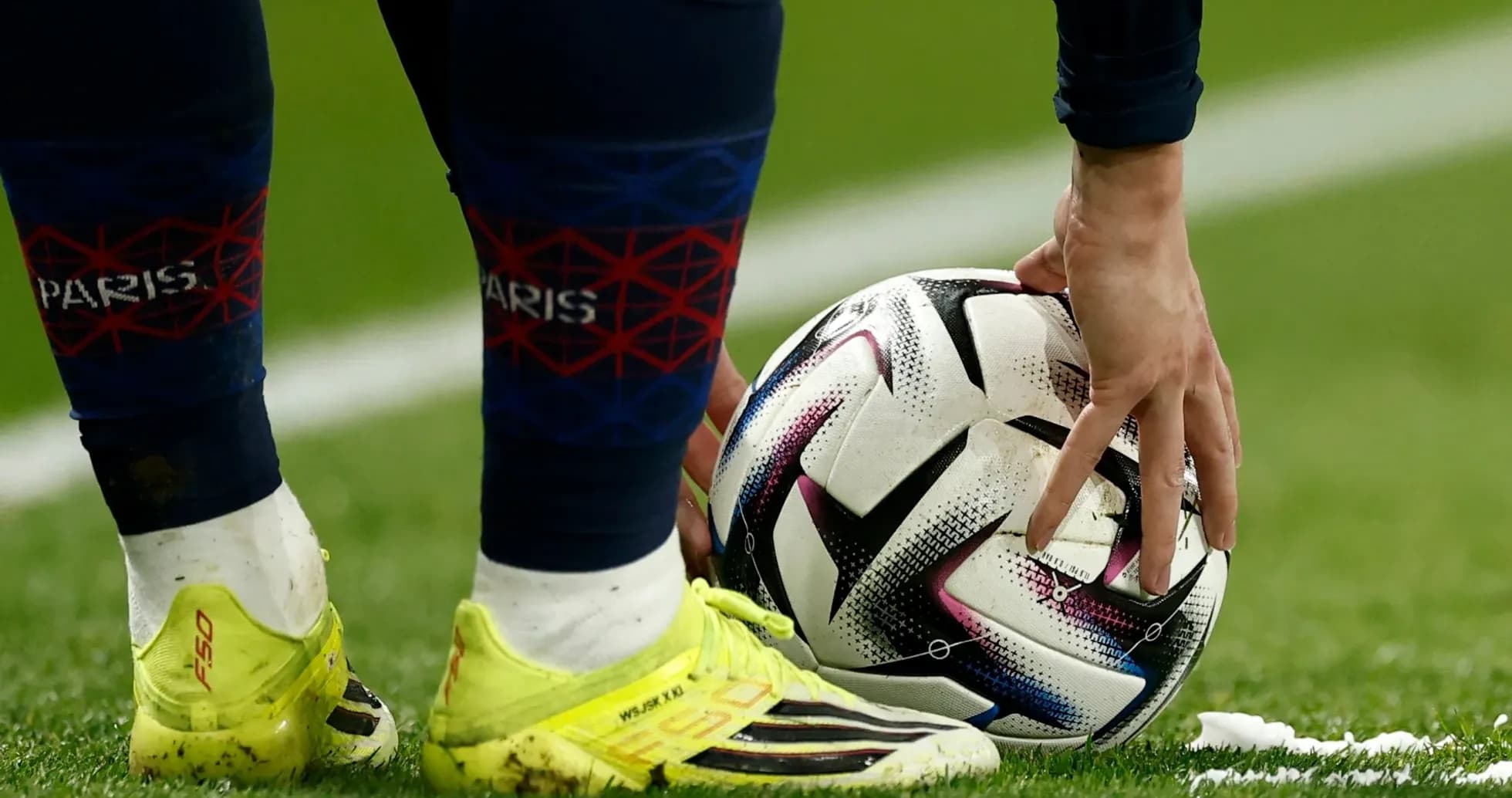 Player preparing to take a free kick on field Player preparing to take a free kick on field