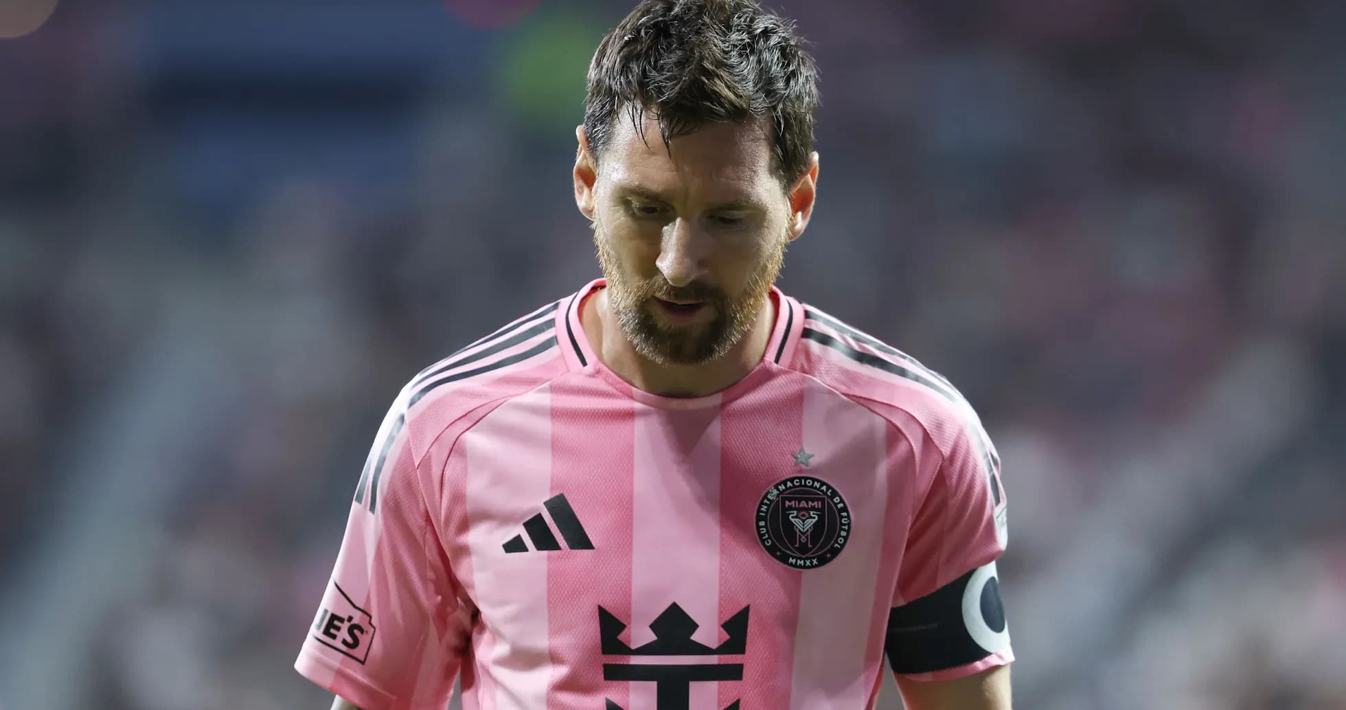Player in pink jersey walking on the field Player in pink jersey walking on the field