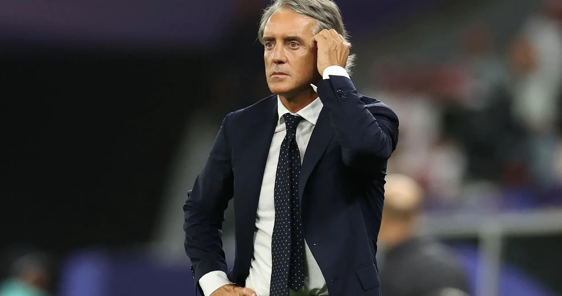 Manager looking thoughtful on the sidelines during match Manager looking thoughtful on the sidelines during match