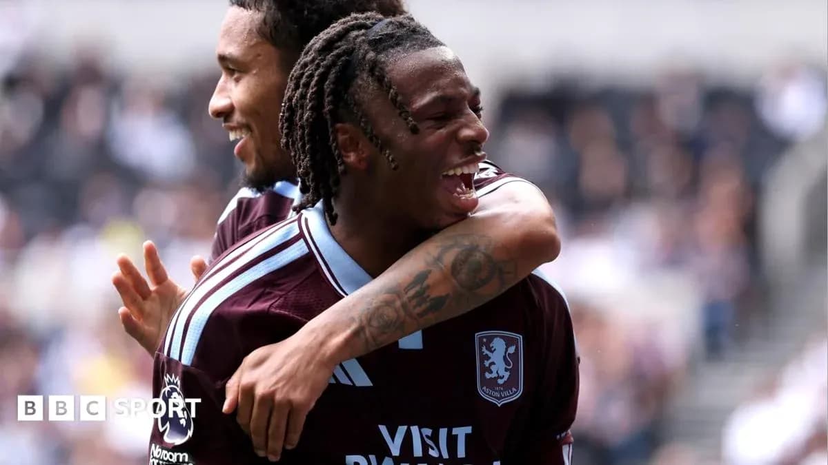 Aston Villa players celebrating a goal on field Aston Villa players celebrating a goal on field