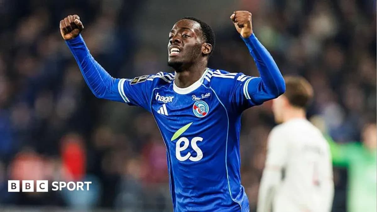 Player celebrating with raised arms in blue jersey Player celebrating with raised arms in blue jersey