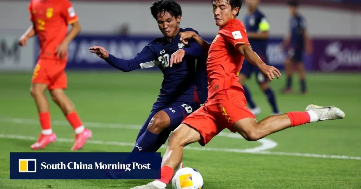Players from China and Japan contesting the ball Players from China and Japan contesting the ball