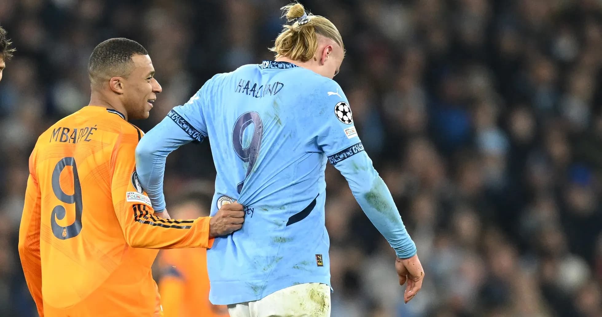 Kylian Mbappé pulling Erling Haaland's shirt Kylian Mbappé pulling Erling Haaland's shirt