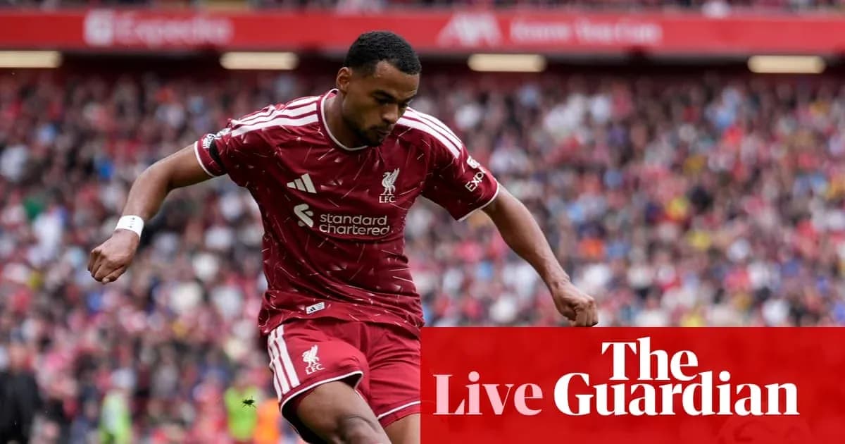 Liverpool player dribbling the ball during match Liverpool player dribbling the ball during match