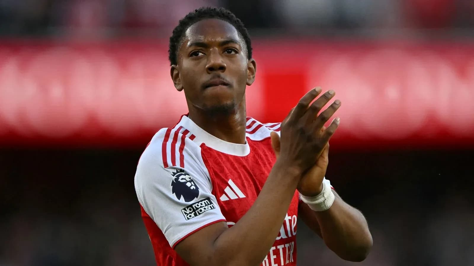 Player applauding fans in Arsenal kit at stadium Player applauding fans in Arsenal kit at stadium
