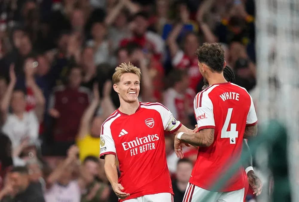 Arsenal players celebrating a goal during match Arsenal players celebrating a goal during match
