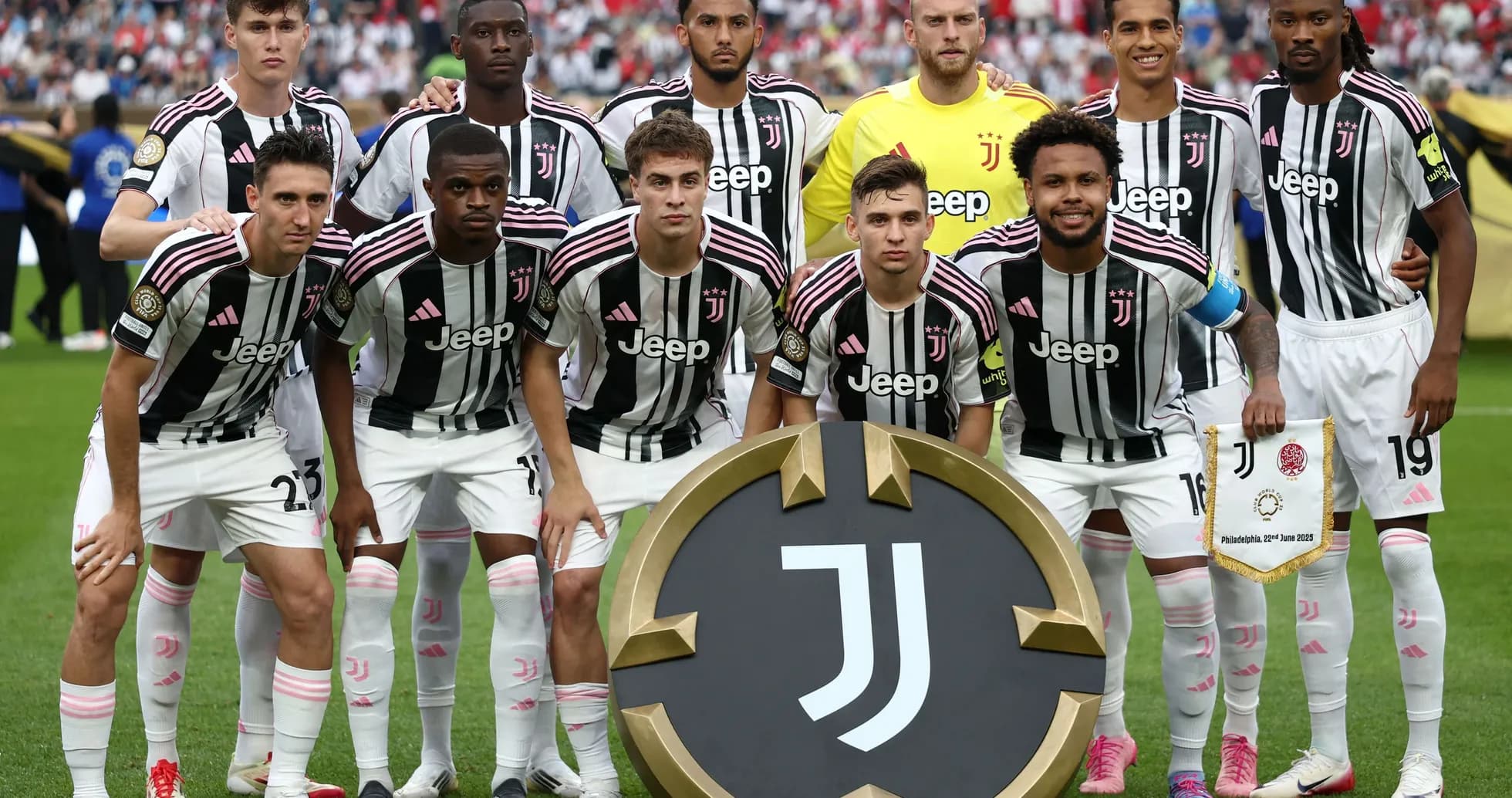 Juventus team posing with club emblem and banner Juventus team posing with club emblem and banner