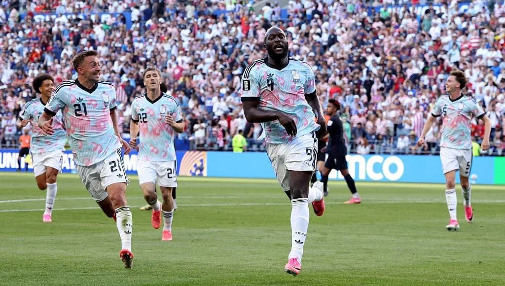 Players celebrating a goal during a match Players celebrating a goal during a match