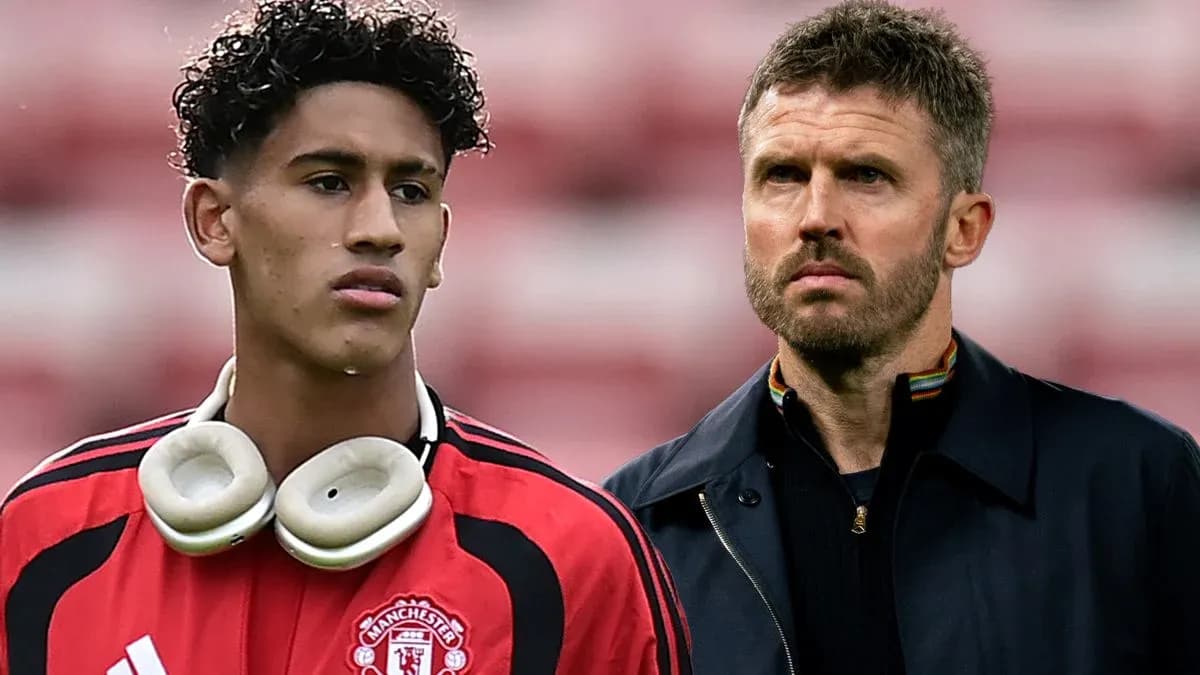Young player in Manchester United kit with headphones Young player in Manchester United kit with headphones