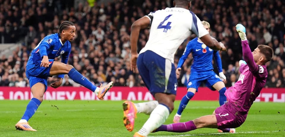 Chelsea player attempting to score against Tottenham Chelsea player attempting to score against Tottenham