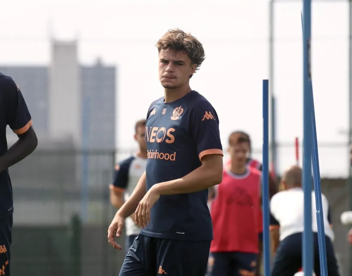 Player walking during training session on pitch Player walking during training session on pitch