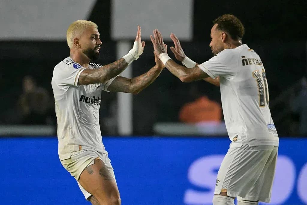 Two players celebrating a goal during match Two players celebrating a goal during match