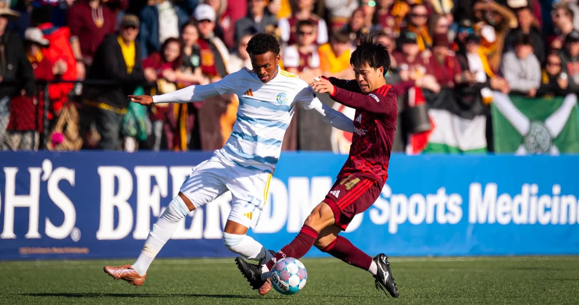 Players competing for the ball in USL match Players competing for the ball in USL match