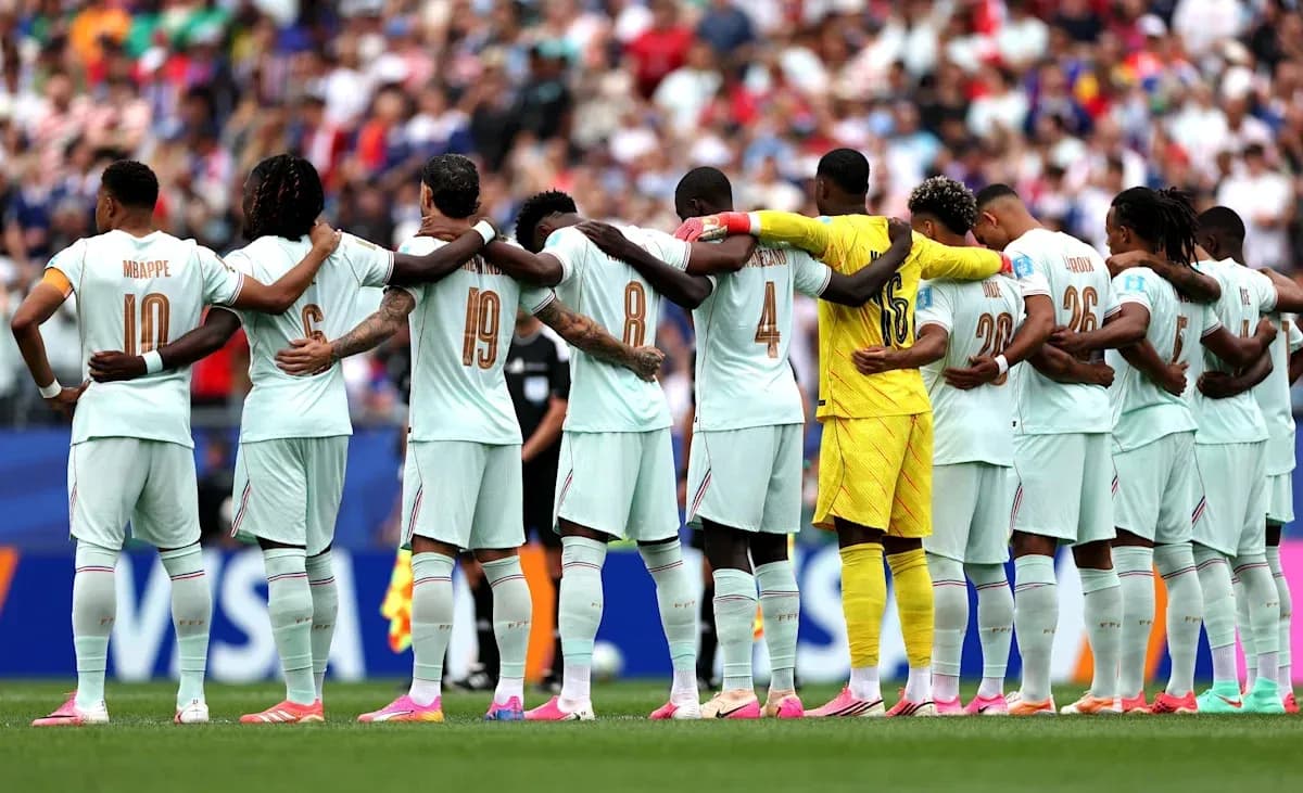 Team standing in solidarity before match kickoff Team standing in solidarity before match kickoff