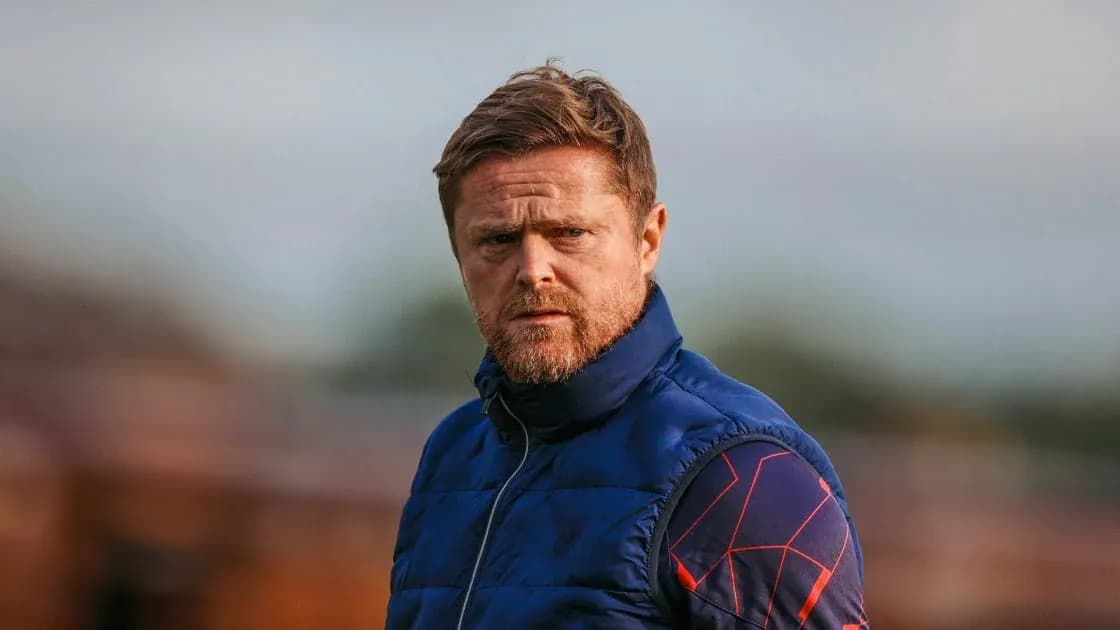 Coach observing training session on the field Coach observing training session on the field