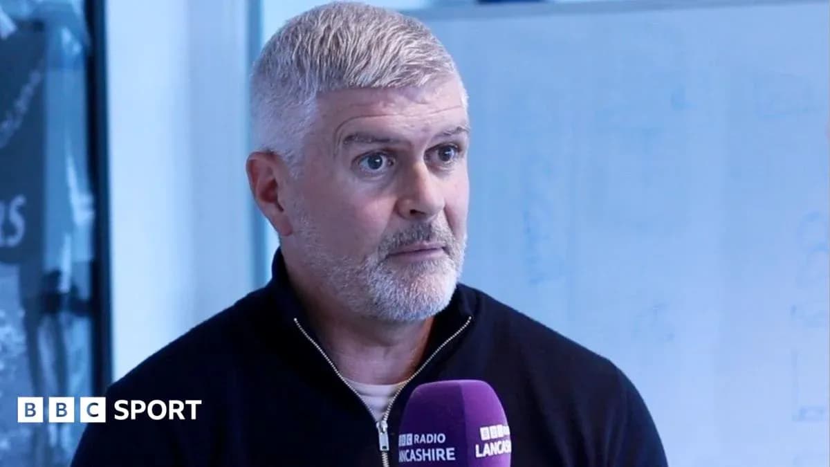 Person speaking into microphone during interview Person speaking into microphone during interview
