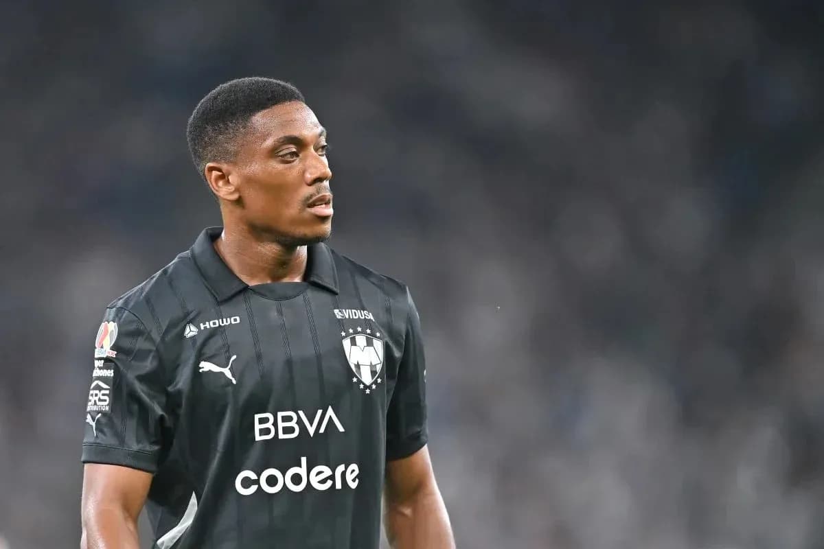 Player in black jersey during football match Player in black jersey during football match