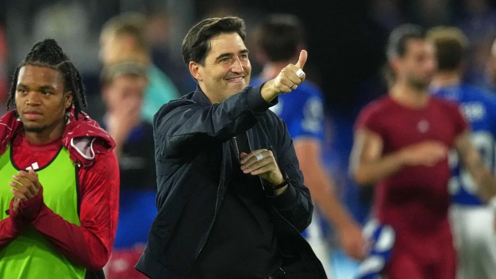 Coach celebrating with thumbs up after match Coach celebrating with thumbs up after match