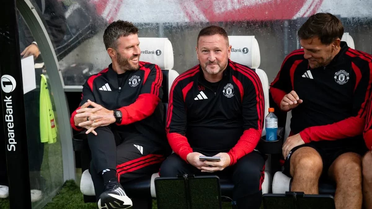 Coaching staff seated on bench during match Coaching staff seated on bench during match