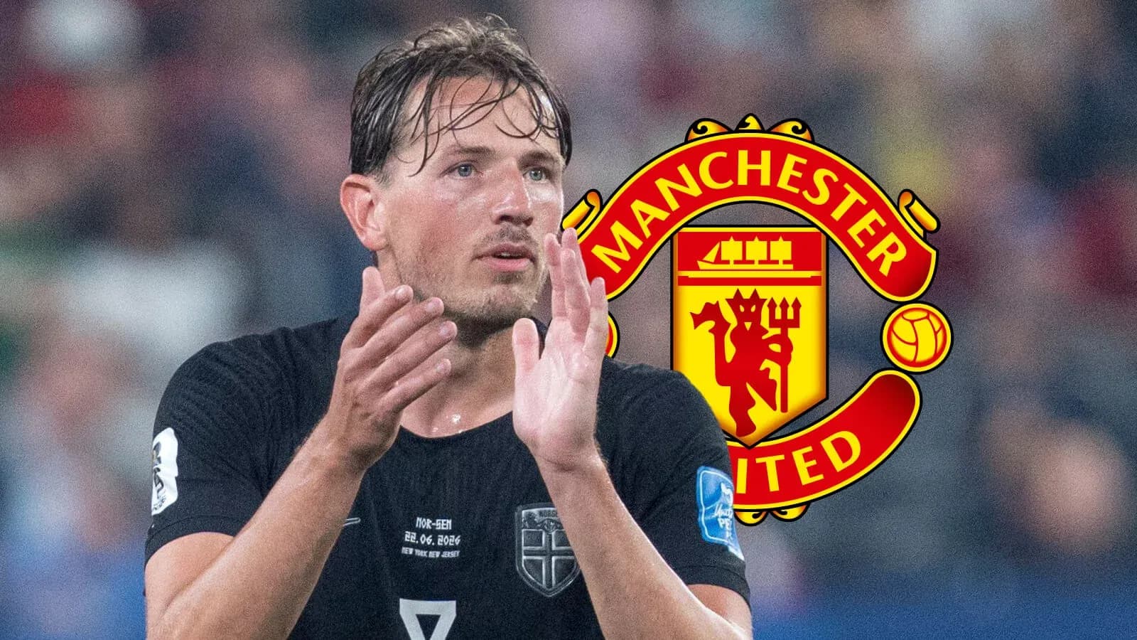 Player applauding with Manchester United logo in background Player applauding with Manchester United logo in background