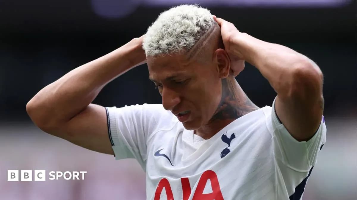 Player holding head in disappointment on field Player holding head in disappointment on field