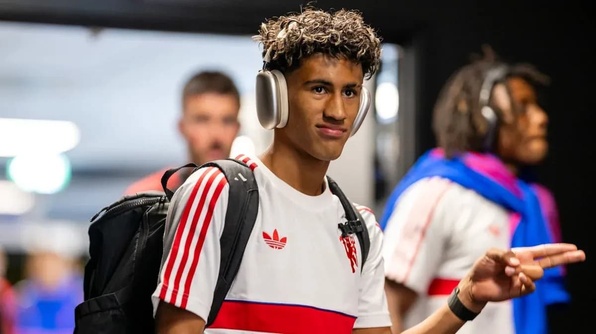 Player wearing headphones entering stadium tunnel Player wearing headphones entering stadium tunnel
