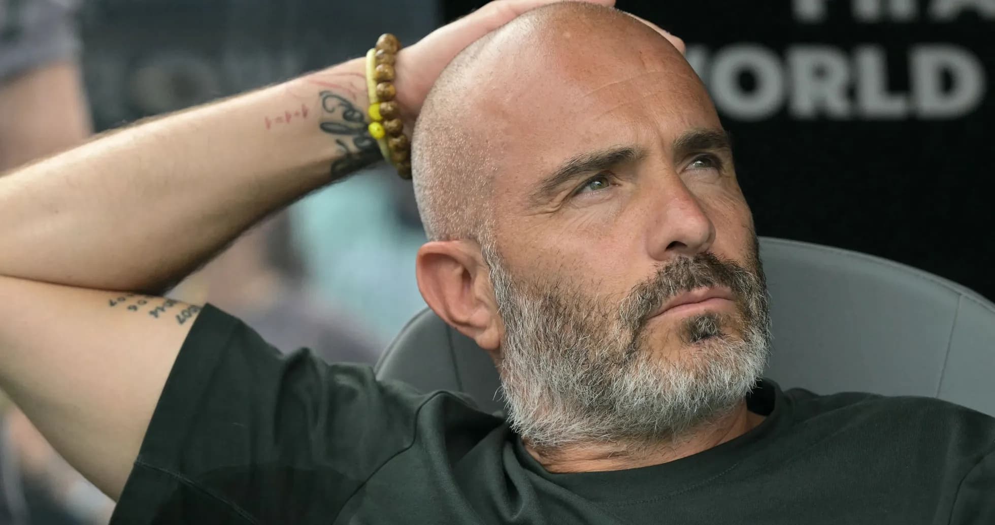 Coach sitting in dugout during a match Coach sitting in dugout during a match