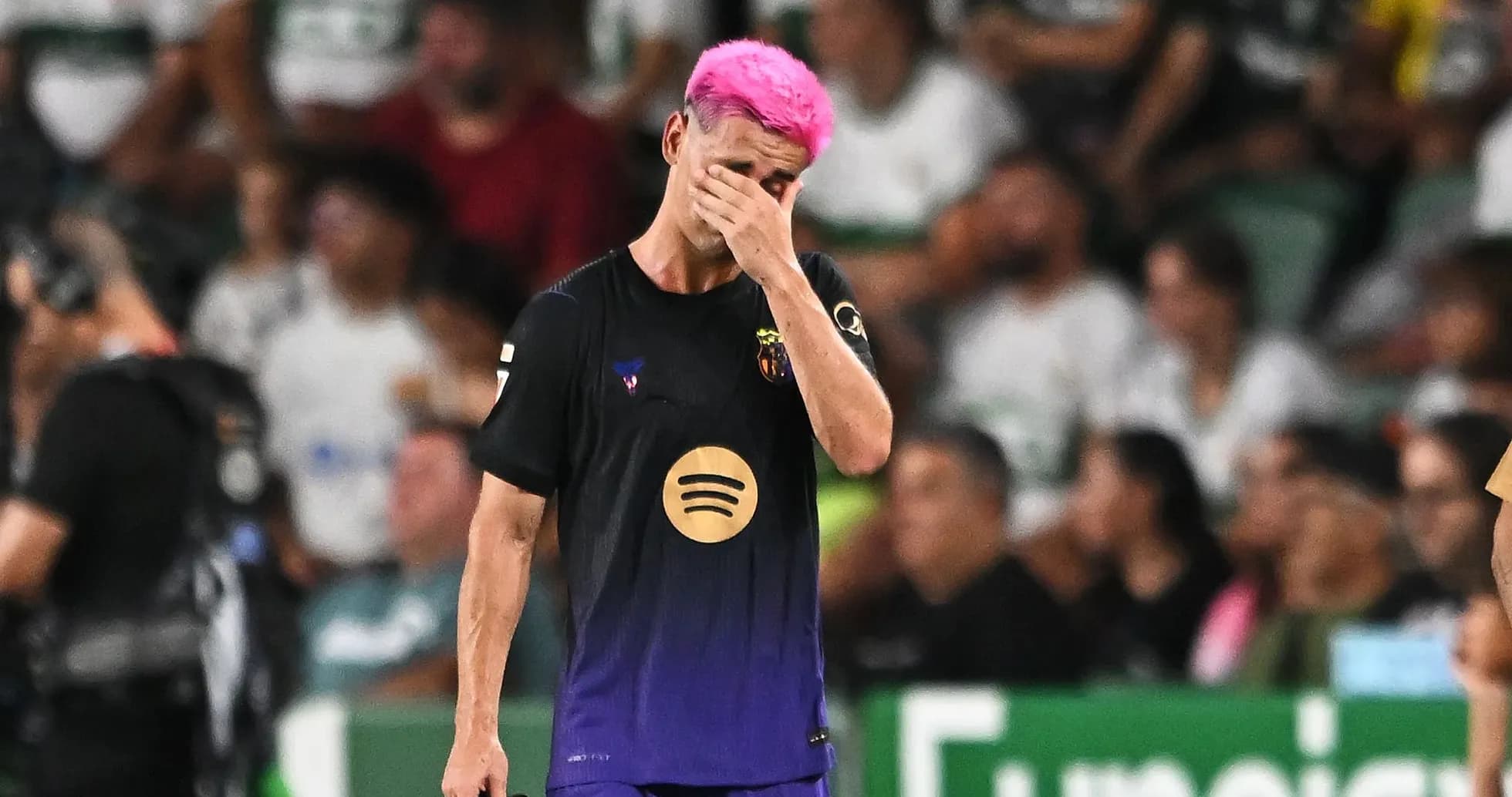Player with pink hair walking off the field Player with pink hair walking off the field