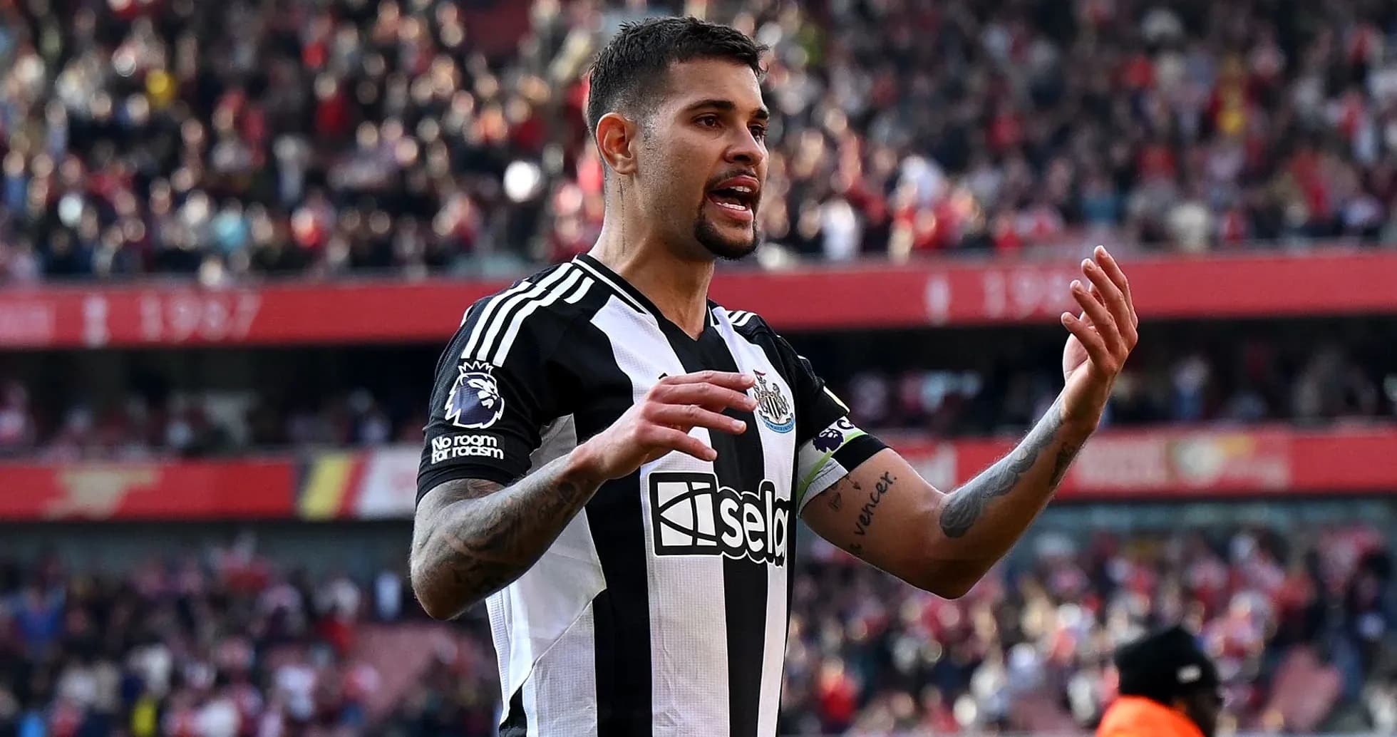 Newcastle player gesturing during match at stadium Newcastle player gesturing during match at stadium