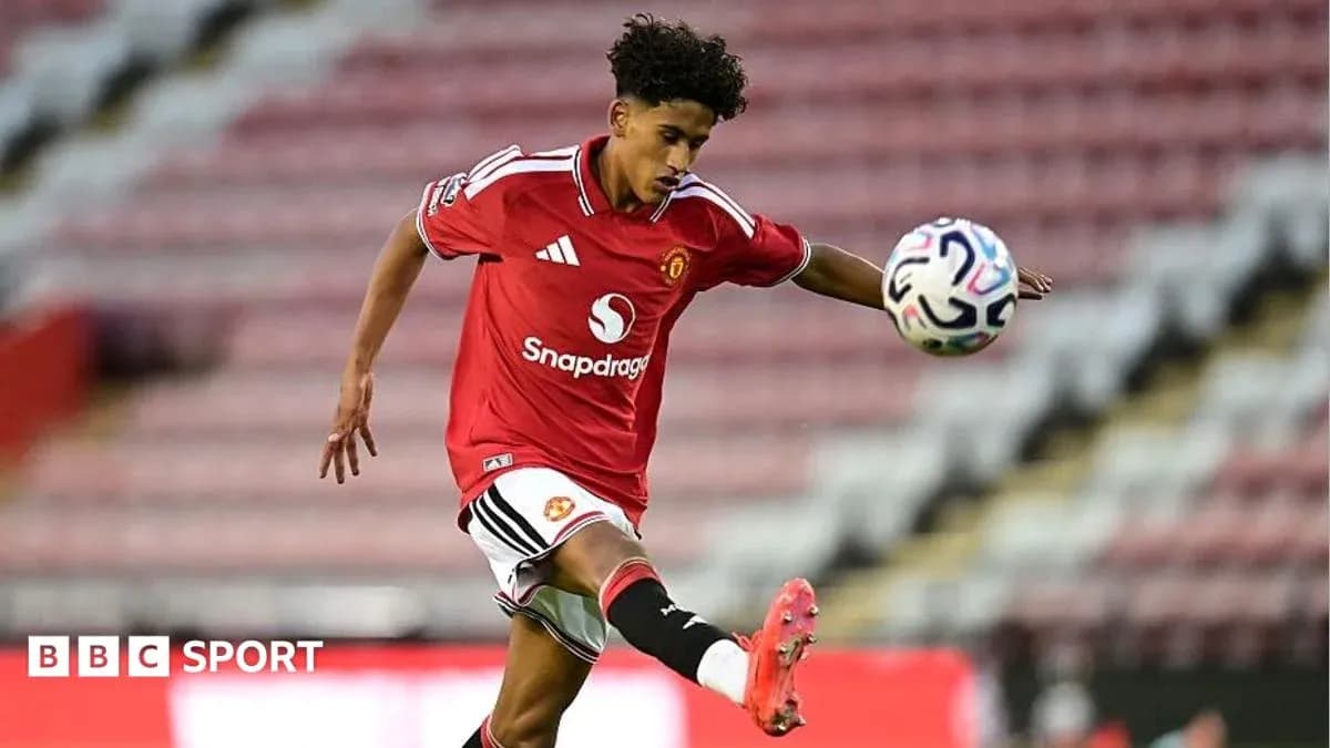 Player kicking ball during Manchester United match Player kicking ball during Manchester United match