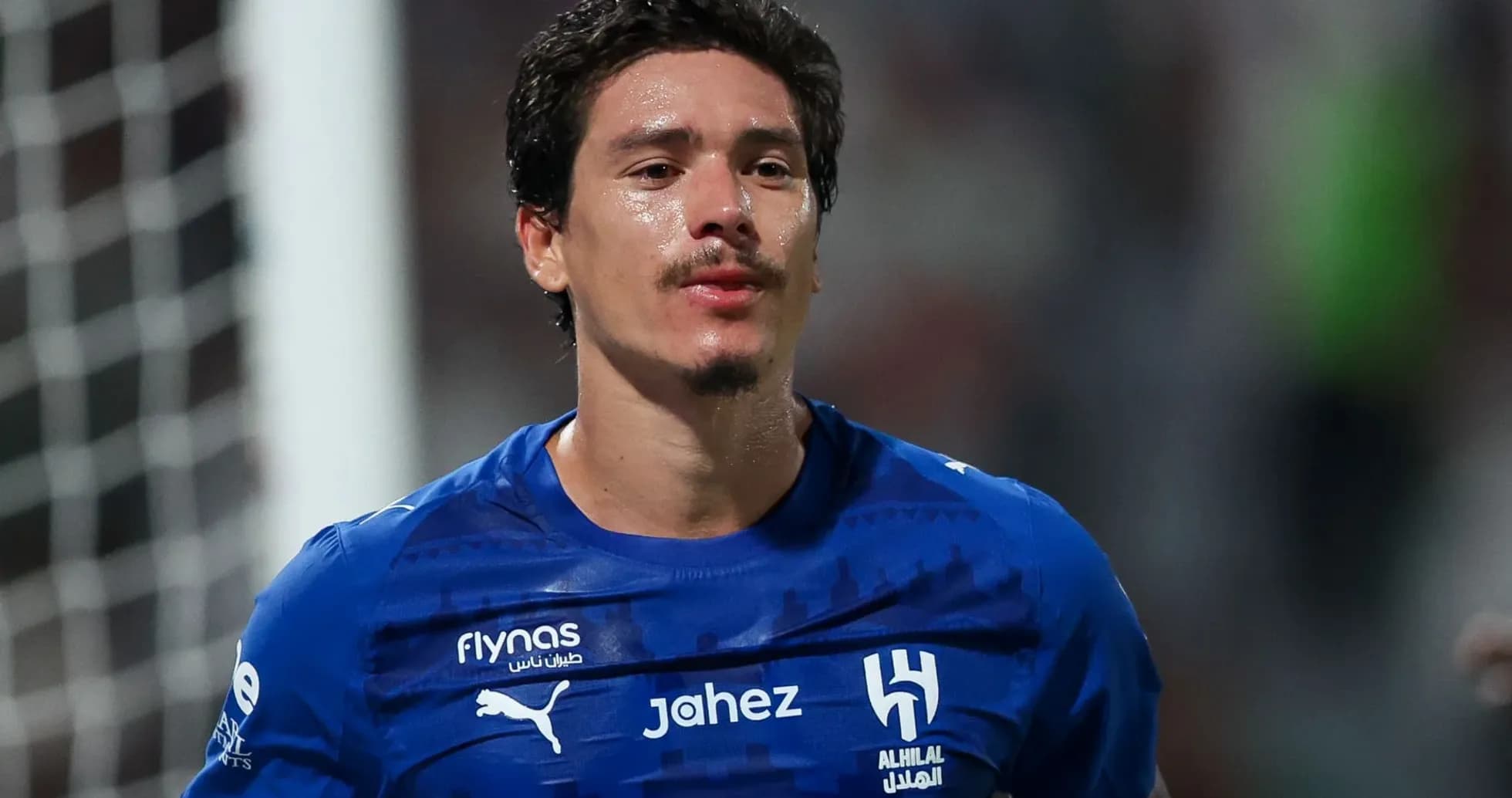 Player in blue jersey after a match Player in blue jersey after a match