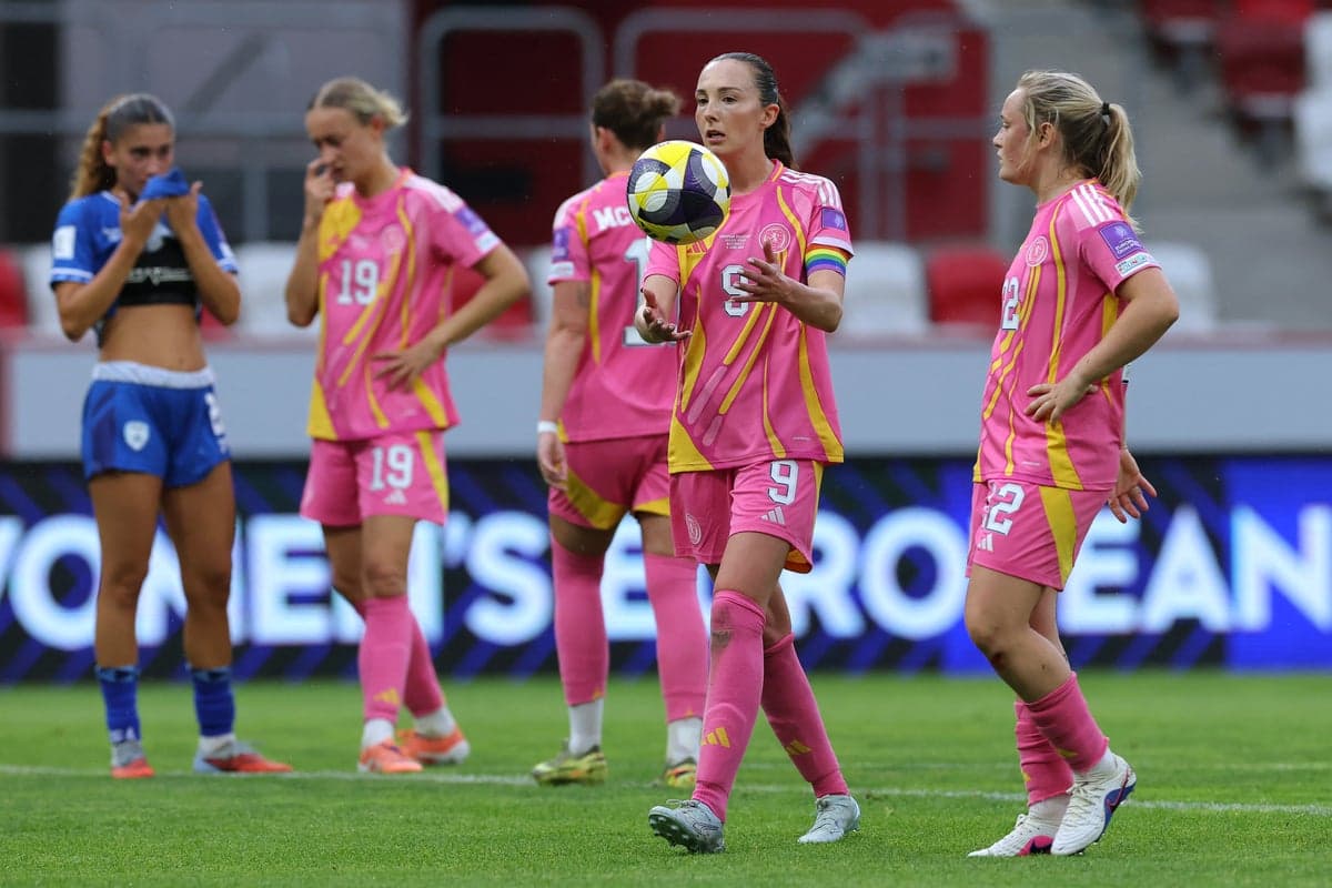 Players in pink jerseys during a match on field Players in pink jerseys during a match on field