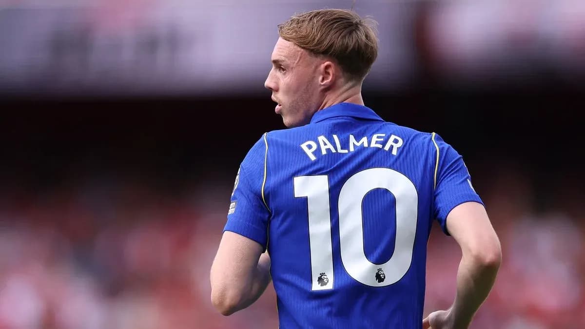 Player in blue jersey with number 10 and name Palmer Player in blue jersey with number 10 and name Palmer