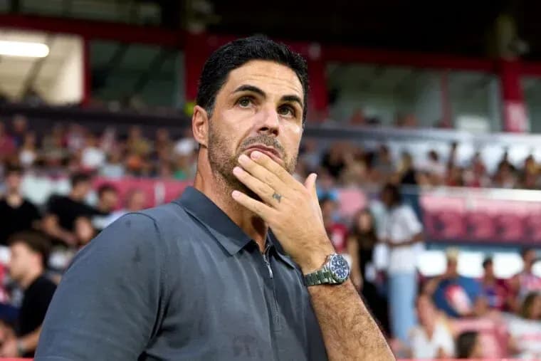 Manager observing the match from the sidelines Manager observing the match from the sidelines