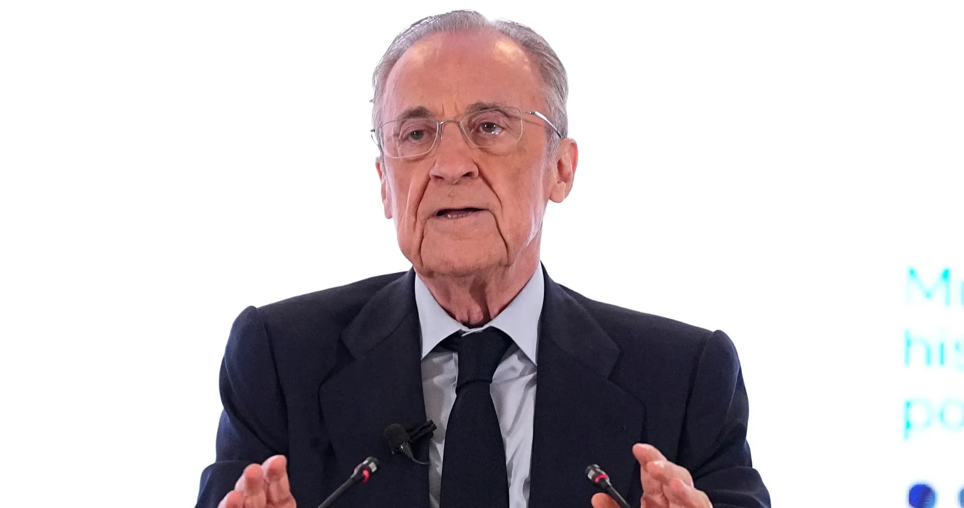 Man speaking at a podium during a conference Man speaking at a podium during a conference