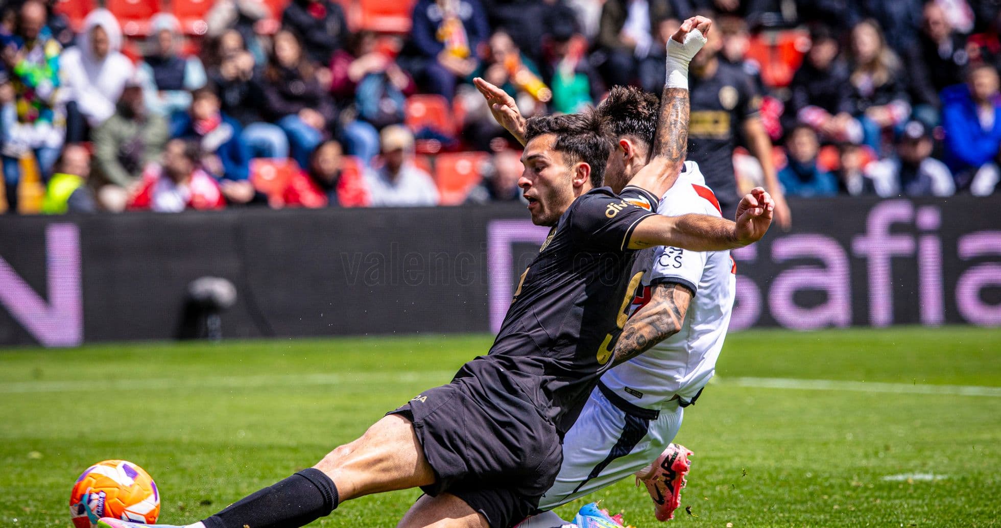 Players colliding during Valencia vs Rayo Vallecano match Players colliding during Valencia vs Rayo Vallecano match