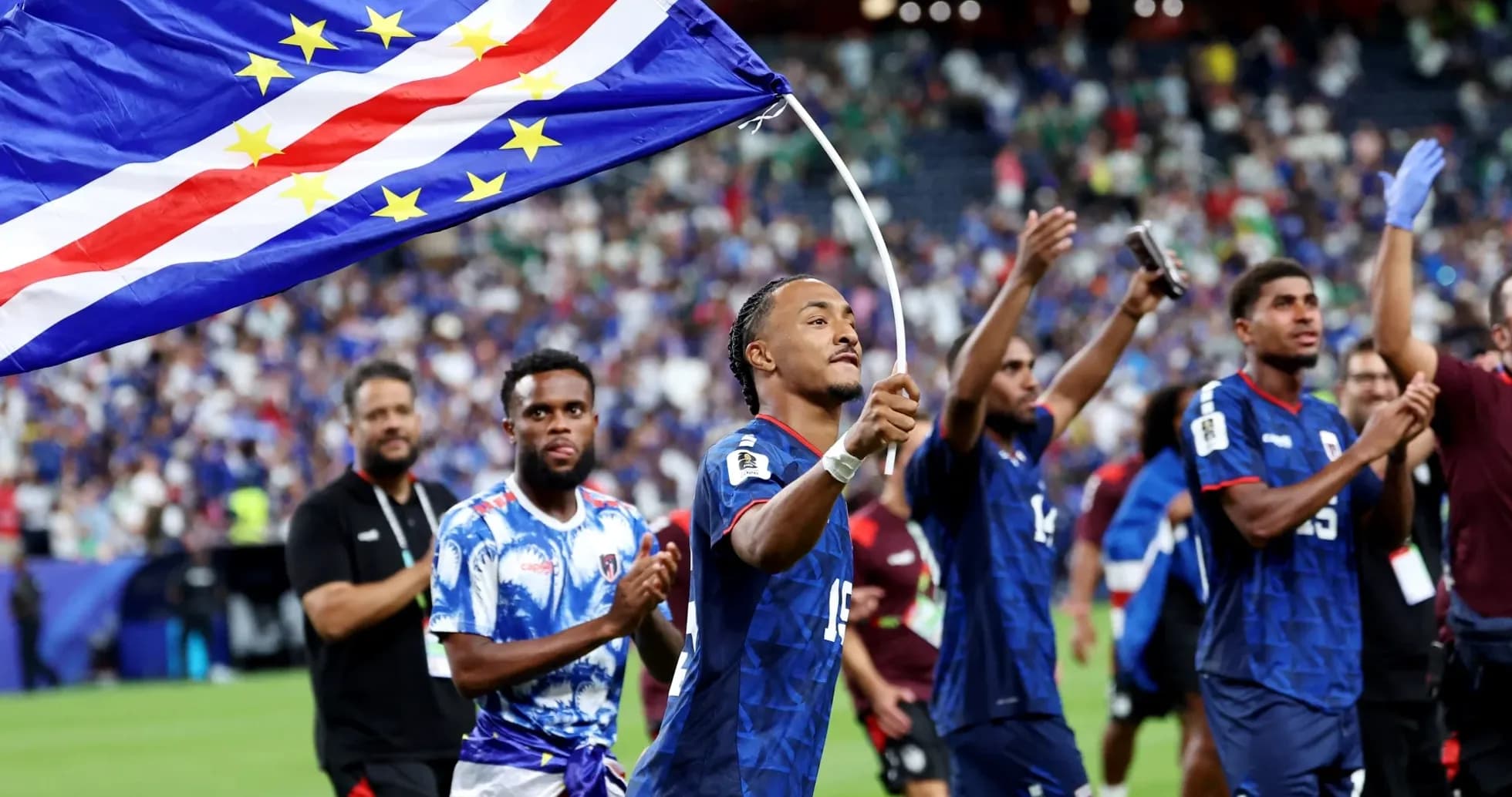 Player celebrating with Cape Verde flag after match Player celebrating with Cape Verde flag after match