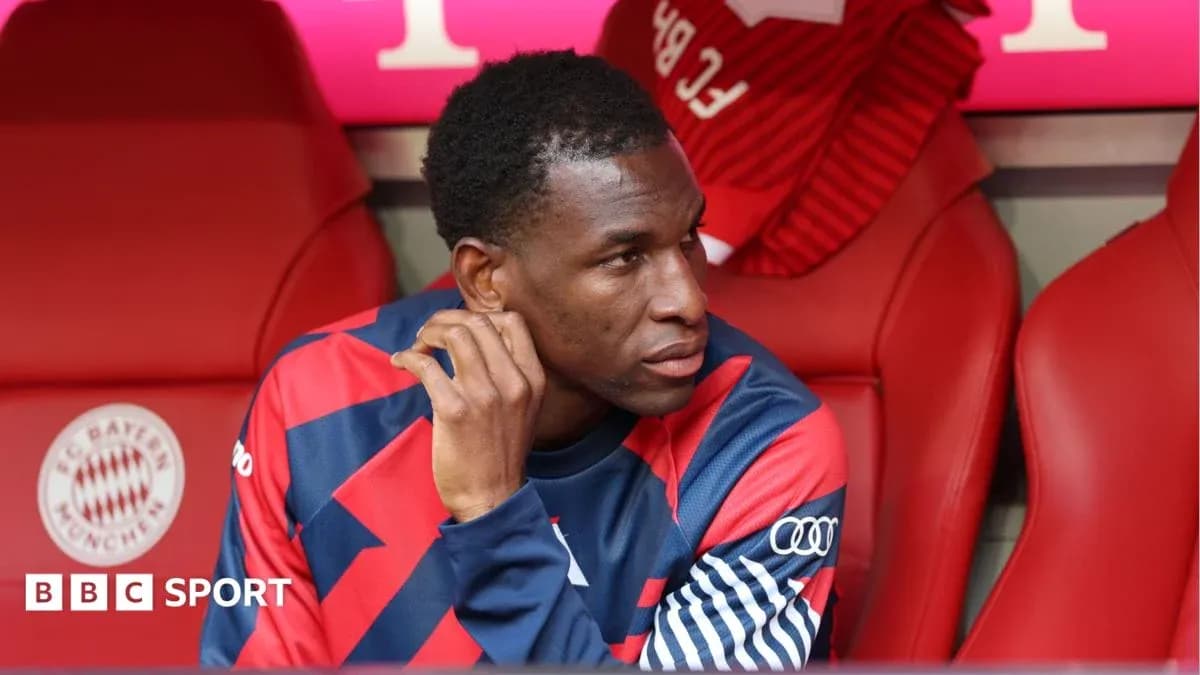 Player seated on bench during match at stadium Player seated on bench during match at stadium