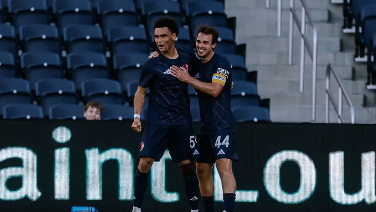 Players celebrating a goal during match Players celebrating a goal during match