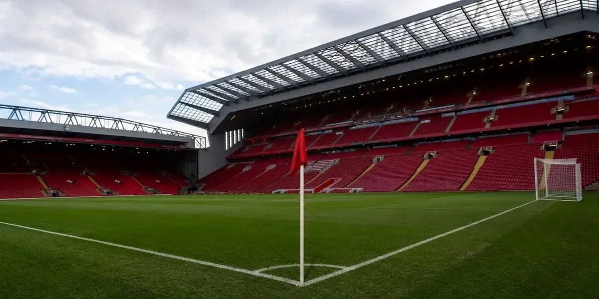 Corner flag in empty stadium with red seats Corner flag in empty stadium with red seats