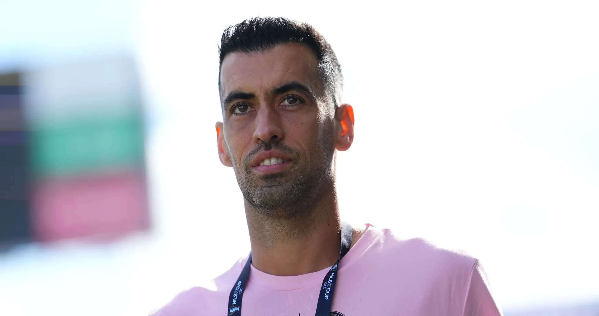 Player wearing pink shirt at stadium entrance Player wearing pink shirt at stadium entrance