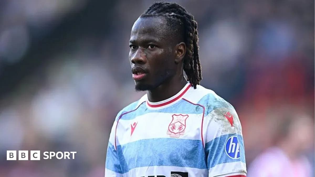 Player wearing blue and white striped jersey during match Player wearing blue and white striped jersey during match