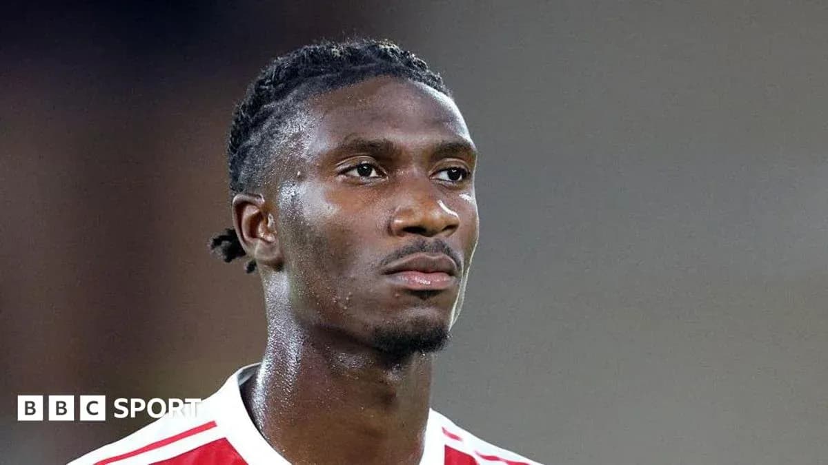 Player in red and white jersey during match Player in red and white jersey during match