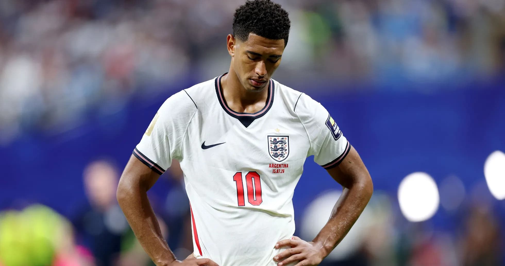 England player with head down on the pitch England player with head down on the pitch